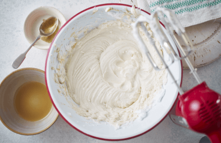 vanilla cheesecake filling being whisked