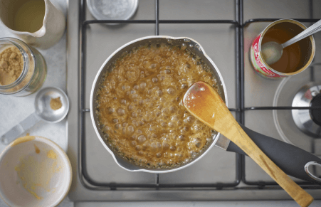 vegan caramel sauce being made in a saucepan