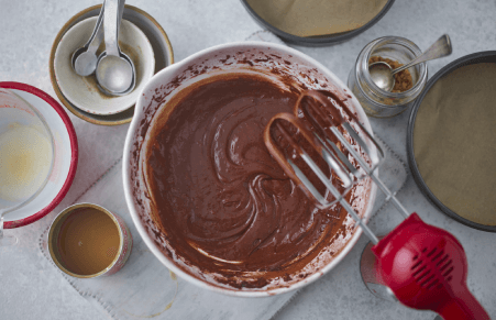 Vegan Chocolate Fudge Cake Batter Being Mixed in a Bowl