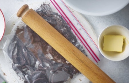 crushing biscuits with rolling pin