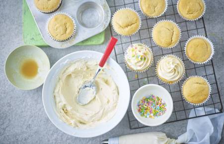 vegan cupcakes being iced