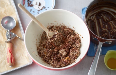 shredded wheat being mixed with chocolate