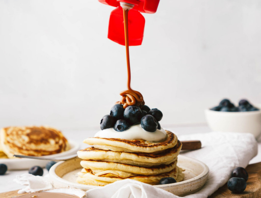 carnation caramel drizzle sauce with pancakes topped with fruit and caramel sauce