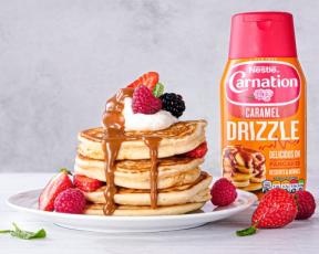 carnation caramel drizzle sauce with pancakes topped with fruit and caramel sauce